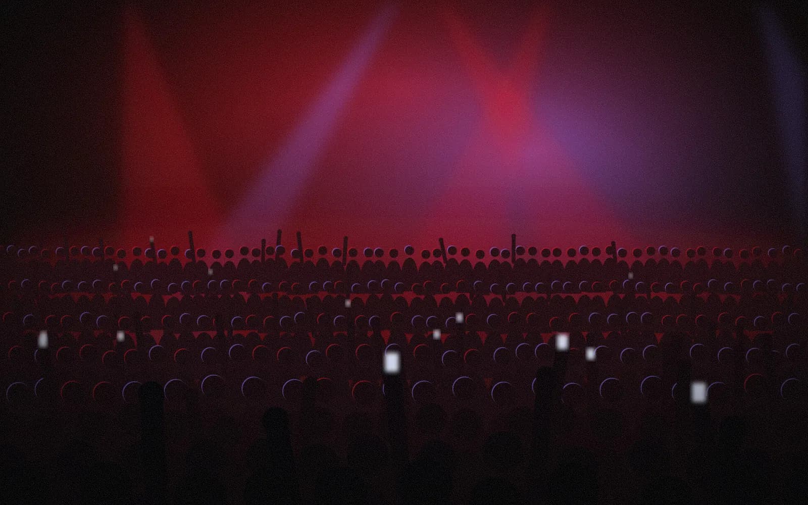 A crowd with raised hands under red and violet stage light