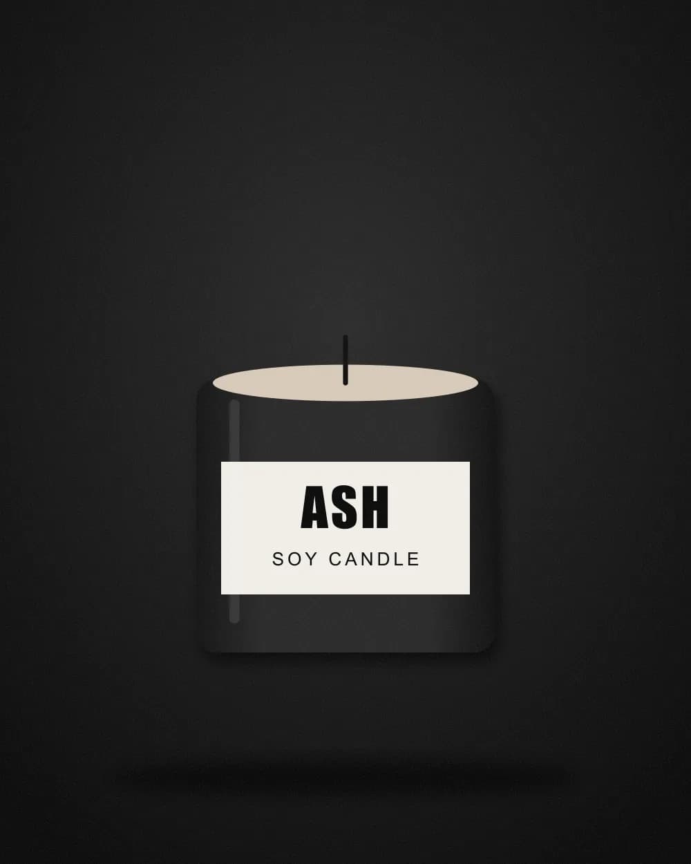 Charcoal candle jar with a paper label reading Ash Soy Candle