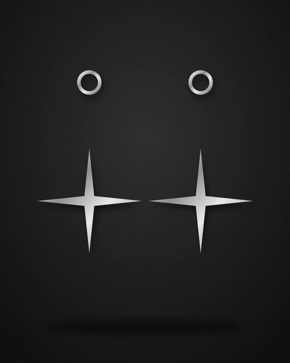Pair of silver drop earrings ending in four-point stars